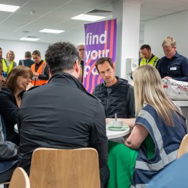 Andy Murray sat at a table with four people in conversation
