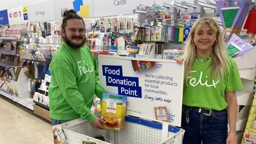 Volunteers standing by food donation point