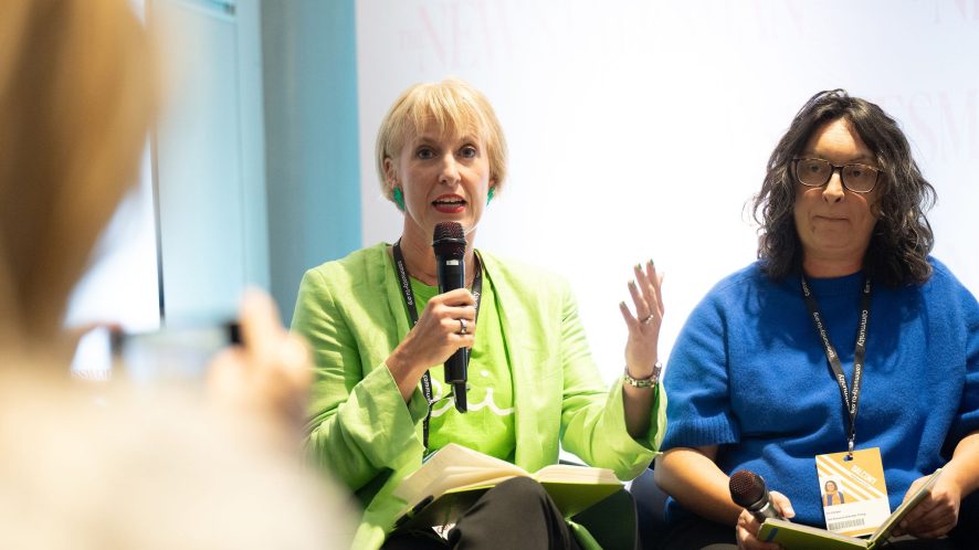 Charlotte Hill OBE, CEO of Felix, holds a microphone mid sentence while speaking at the New Statesman panel event