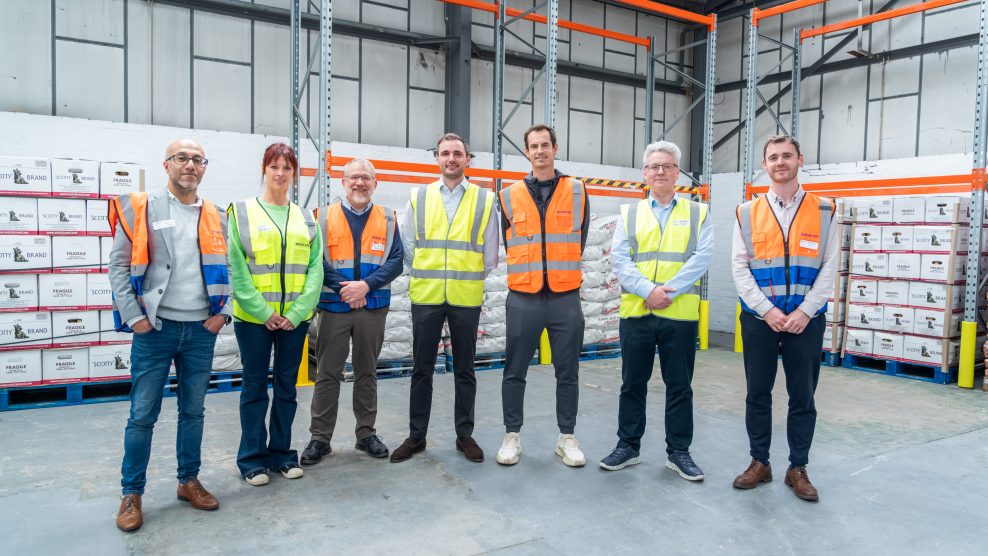Andy Murray and members of the Felix / Move On team stood together in a warehouse